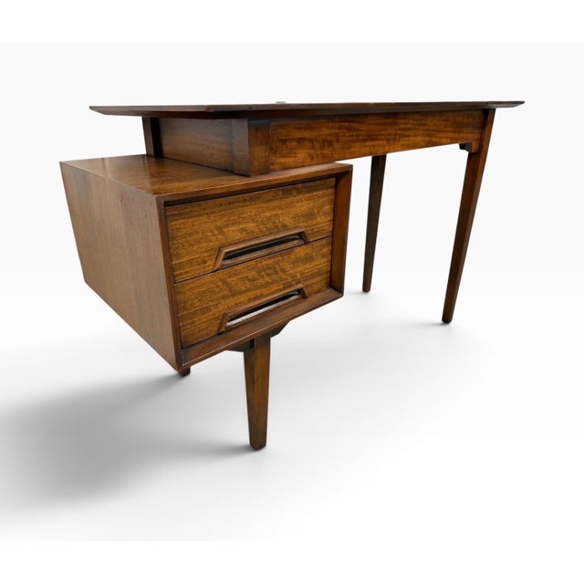 A striking example of 1950s American modern design, this Drexel Perspective walnut vanity / desk, designed by Milo...