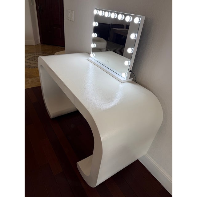 This stunning sculptural desk by Made Goods features a modern waterfall silhouette in a cream raffia finish. Originally...