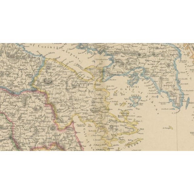This elegant antique map depicts greece together with the ionian islands, presenting the country’s political and...