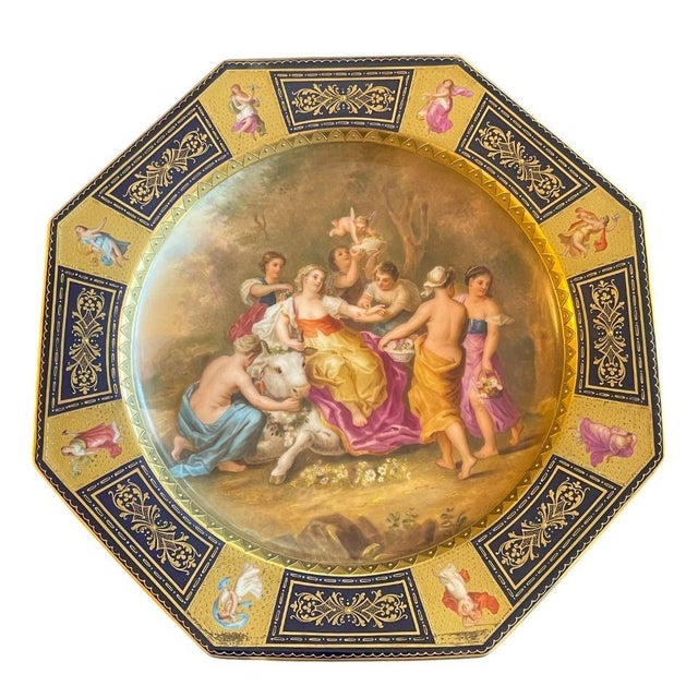 A striking set of six Royal Vienna porcelain cabinet plates, each beautifully decorated with richly colored hand-painted...