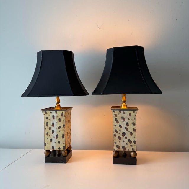Vintage pair of giraffe safari patterned tole table lamps paired with vintage black pagoda lampshades with gold foil liners.
