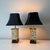 Vintage pair of giraffe safari patterned tole table lamps paired with vintage black pagoda lampshades with gold foil liners.