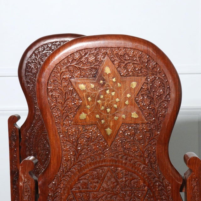 Elaborately carved Rosewood Ango-Indian side chairs with inlaid details. Freshly upholstered in an Indian block print with...