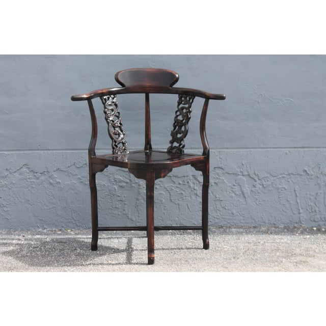 A beautiful and meticulously carved asian corner chair, antique. Carved mahogany. Look at the detail on this beautiful...