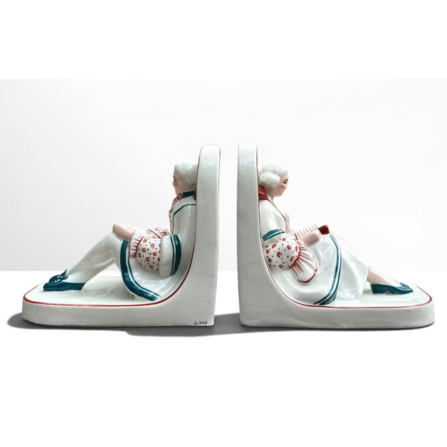 Impressive pair of earthenware bookends in pure Art Deco style, made by the ceramist Henri Delcourt (each piece is signed...