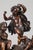 Patinated bronze allegorical group featuring three putti on a cliff strewed with wheat. Two of them are playing the drum...