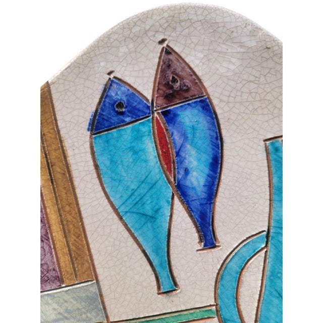 Vintage Italian ceramic wall plaque by Raymor features a striking mid-century modern still life composition. Hand-painted...
