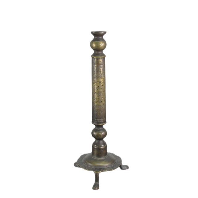 This solid Turkish brass candle holder with hand etched patterns is a vintage piece originating from Turkey. The candle...