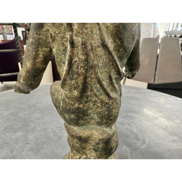 A lovely bronze antique sculpture of a fisherman after the antique excavated in Naples in the early 19th century. These...