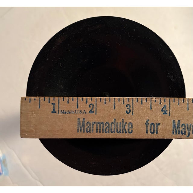 Gorgeous pair of candlestick holders with a metal base and top with a stem in vibrant colors and geometric shapes...