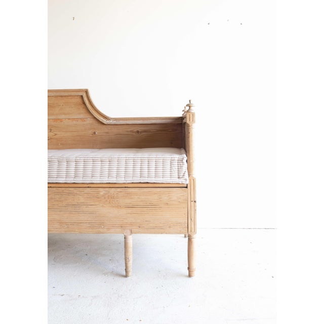 19th c Swedish pine bench or day bed, with a new French mattress in a classic Ian Mankin ticking stripe. The piece is...