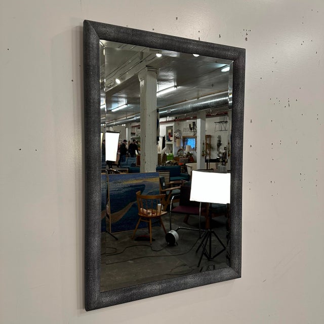 Like new Made Goods faux shagreen Mirror. The narrow profile mirror features stingray-inspired leather wrapped creating a...
