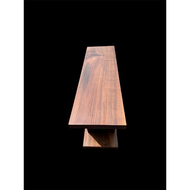 A striking blend of artistry and utility, this handcrafted solid walnut coffee table was built in 2024 and inspired by the...