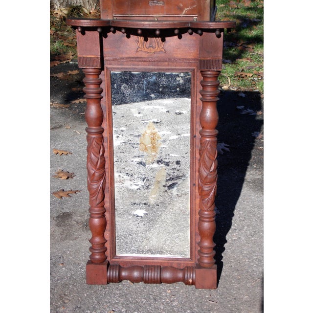 Dating from1880's, this antique Victorian period framed hall pier mirror is hand carved of solid Mahogany and features a...