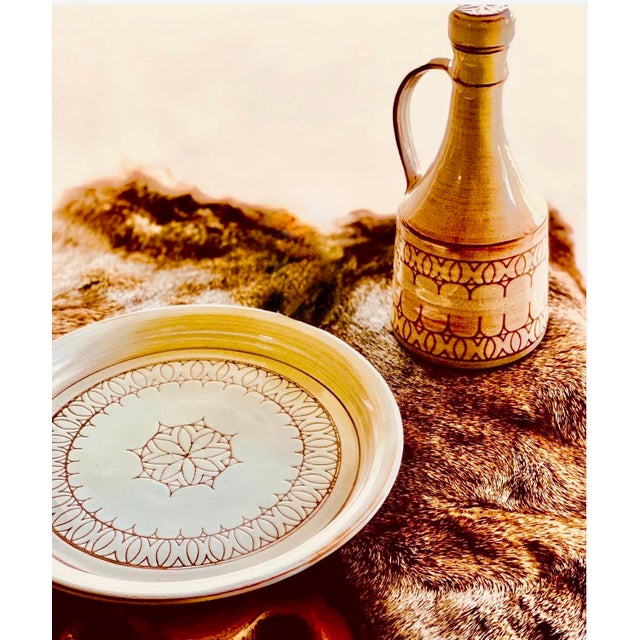 Vintage Mid-Century Modern Art Studio Sgraffito Pottery Carafe, Decanter & Matching Chop Plate Set- 2 Pieces. Sgraffito is...