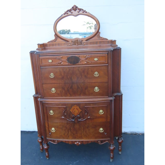 This classic Chest of Drawers is made out of wood, solid wood, exotic wood, veneer, and mirror. This Chest of Drawers...