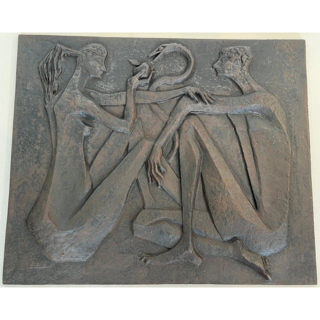 This very beautiful and interesting modernist fireback is made of cast iron. The fireback depicts Adam and Eve, the apple,...