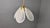 Stunning italian glass chandelier with a brass frame. The chandelier has glass art deco style frosted shades. Tested and...