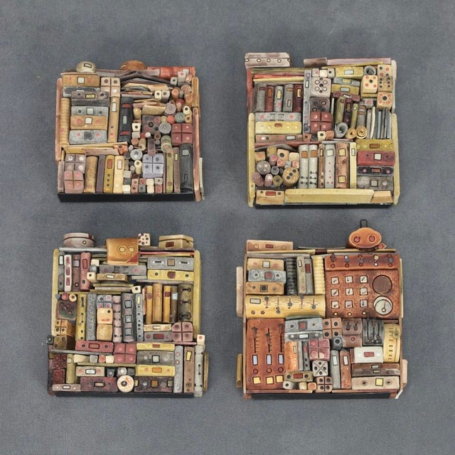 A captivating set of four mixed-media wall sculptures by Belgian artist Guy Deltour, created in the early 2000s. Each...