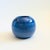 A vintage handmade pottery sphere vase. Finished in varying hues of glossy blue glaze in a stripes wrapping around the...