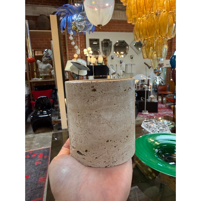 A sculptural cylindrical vessel carved from solid Italian travertine, dating to the 1970s. Defined by its clean,...