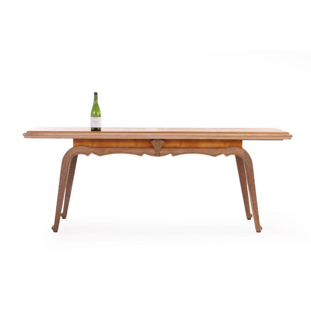 French Art Deco dining table by Claude Olivier Merson, 1937. Sycamore top with cerused oak base. Wd: 88.5" Fully opens to...