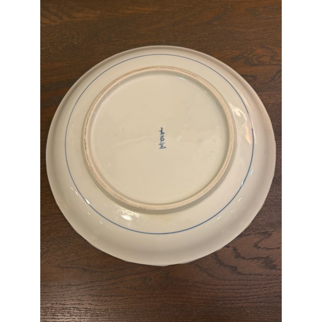 This Signed Japanese Kakiemon large bowl by Sakaida Kakiemon XIII (1906-1982) is Arita-ware that showcases traditional...