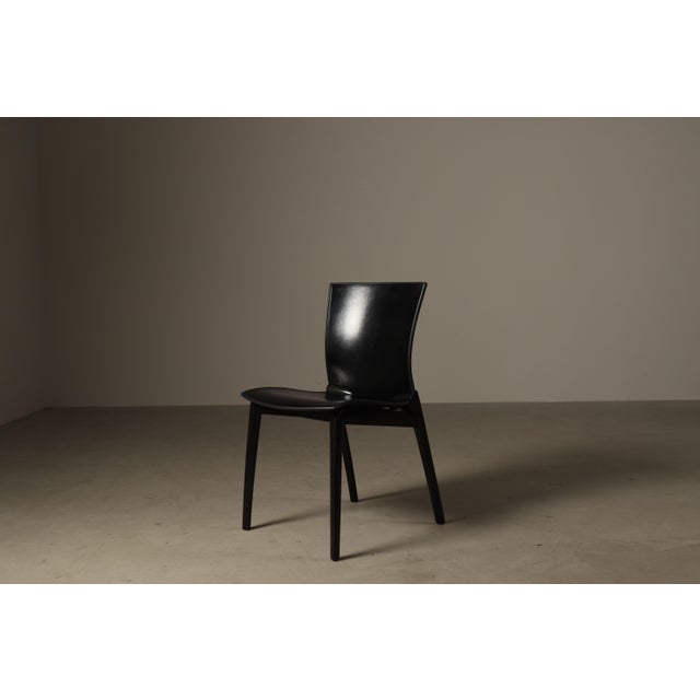 A refined set of seven cos chairs, designed by josep lluscà for cassina in 1994. the cos chair was conceived for both...