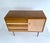 Mid century cabinet / sideboard, two-tone contrasting wood veneer, 3 drawers with slanted facade and a compartment with...