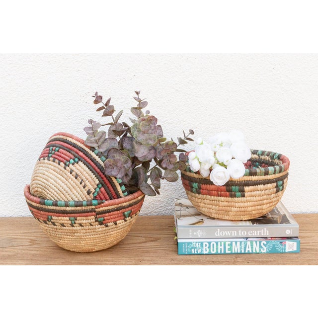 A beautiful set of three African woven grass baskets crafted by the skilled Hausa women of Northern Nigeria. These baskets...