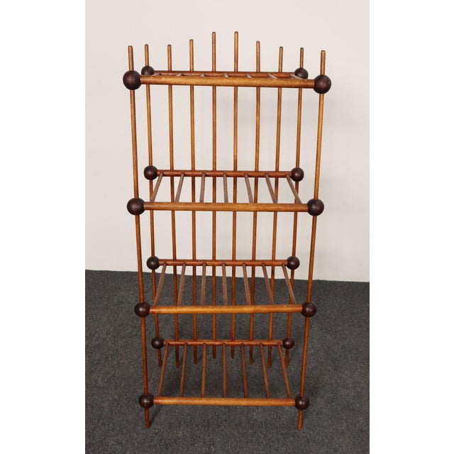 Antique folk art ball and stick etagere/bookcase offering multiple storage/display options while occupying a relatively...