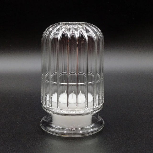 Handmade borosilicate glass candle holder, also designed for outdoor use. Labeled by Maker