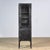 Vintage medicine cabinet from the 1970s, produced in Hungary. The cabinet is made of iron and glass, with the glass held...