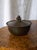 A 1930s vintage just andersen bronze art deco pot featuring a modernist style hand carved decorative lid, lipped rim and...