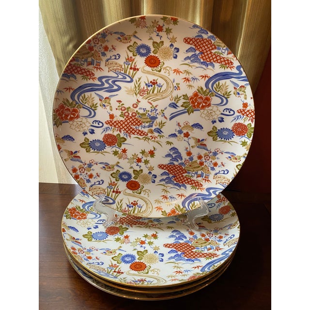 These beautiful large plates were found at an estate sale. They display a garden motif; cottages, flowers, ponds, birds,...