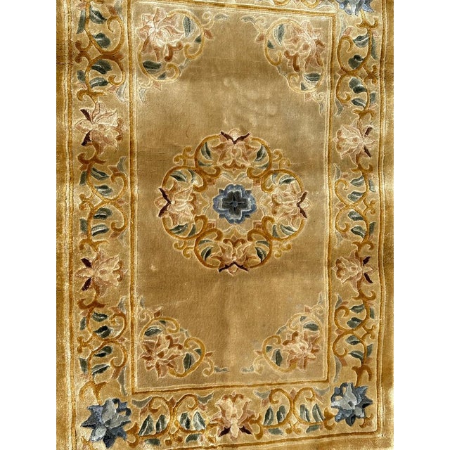 Very beautiful small Chinese rug with nice design and beautiful colours with a yellow background, blue, brown, pink, green...