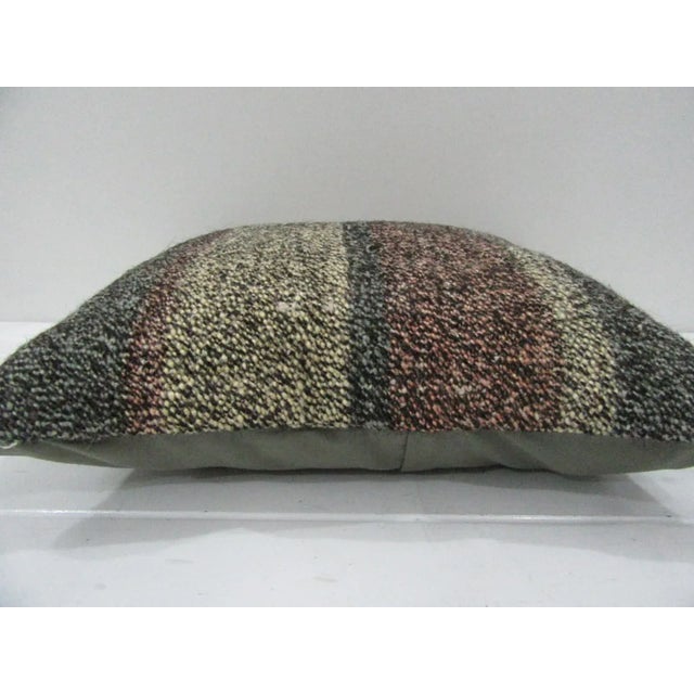 This is a pillow cover made from a vintage kilim rug. The piece was properly washed and ready to use. Pillow inserts not...