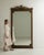 This mirror carries genuine presence, its dark carved wood frame with crest, floor-length tall immediately setting the...