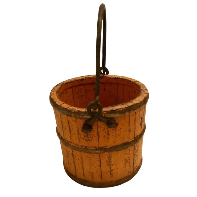 A pretty 19th century wooden French pail with antique paint and beautiful patina. With iron straps and handle.