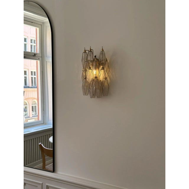 Set of three murano wall sconces consisting of sixteen handmade, sand colored crystal prisms with finishes and fittings...