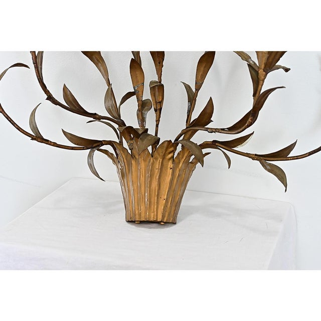 French vintage gold metallic wall sconce of a basket or planter sprouting wild vines of sharp leaves and flowers...