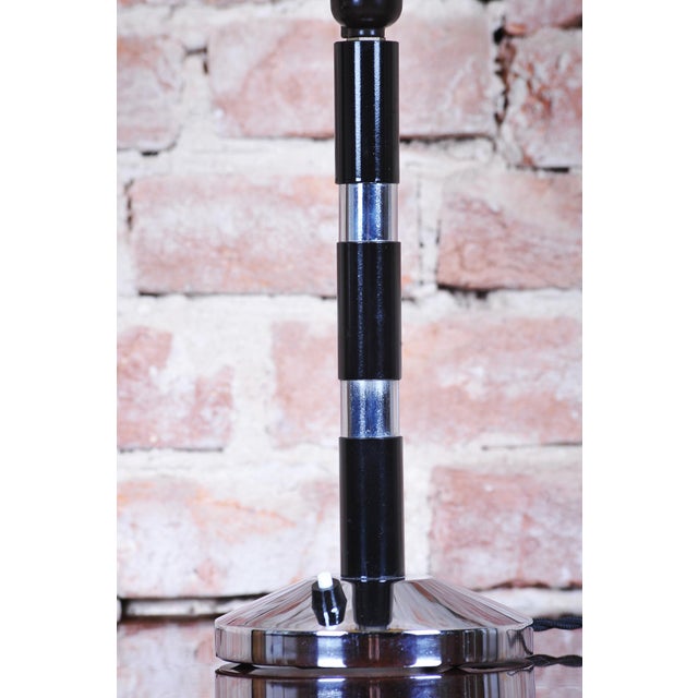 This elegant table lamp originates from the 1930s and stylistically belongs to the Art Deco / Bauhaus period. Its...