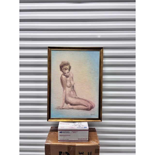 This framed artwork is a figurative piece depicting a seated female nude, signed by the Italian artist Marcello Cassinari...