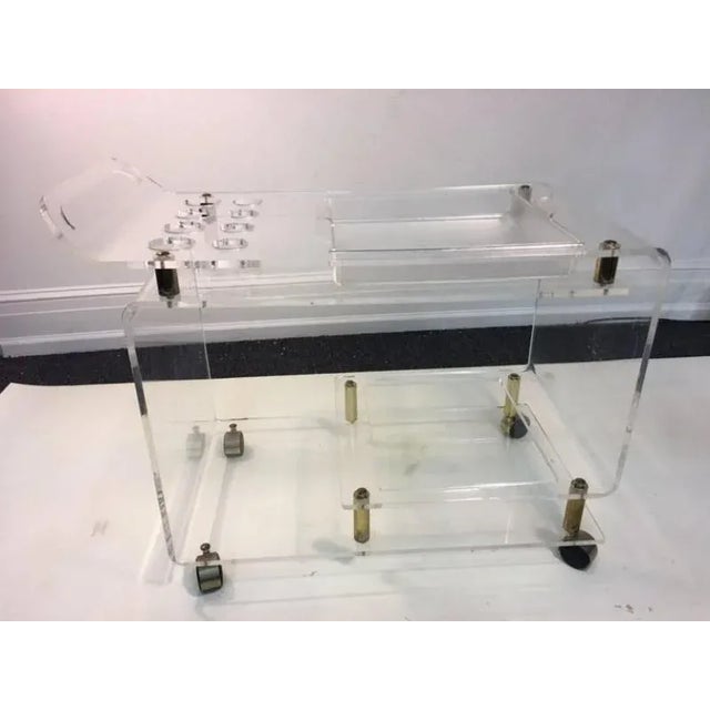 Substantial 1970's Modern Lucite Bar Cart with Double Tiers .There is Removable Lucite Serving Tray and Eight Liquor...