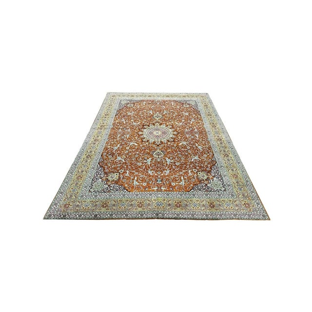 ACTUAL SIZE: 9’11” x 13’7″ PRIMARY COLOR: Orange / Green AGE: Old MATERIALS: Wool FOUNDATION: Cotton PRODUCTION:...