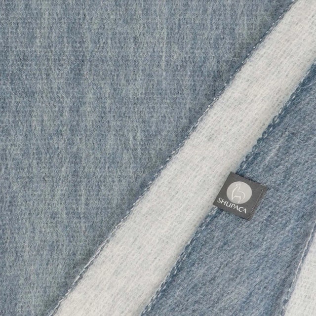 Wrap yourself in warmth and style with this fun alpaca blanket. Its cozy feel will make you never want to leave its...