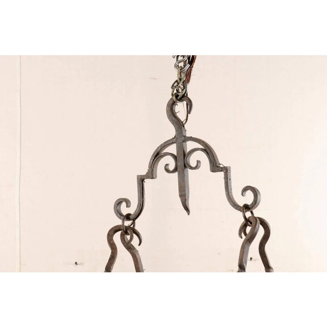 French Mid-Century Eight-Light Forged Iron Chandelier With Hooks and Scrolls For Sale - Image 4 of 9