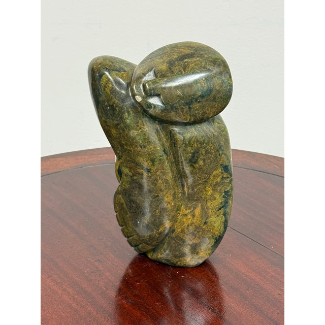 Design Plus Gallery presents an African Hand-Carved Polished Stone Abstract Human Figure Sculpture. This sculptural form...
