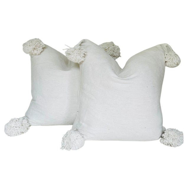 Pair of Moroccan handloomed cotton pom pom pillows with zipper closure New duck feather-and-down fill inserts. Pattern on...