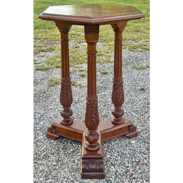 Beautifully carved vintage 1940’s tri column accent table / pedestal with intricate acanthus detail. Crafted in mahogany...